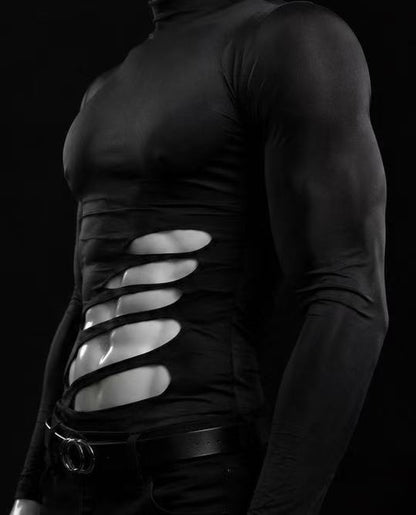 Side view of black cutout long sleeve top highlighting asymmetric side openings and unique garment construction