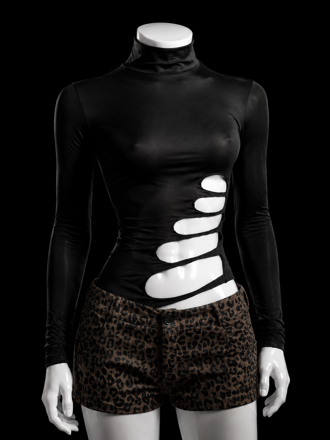 Black long sleeve cutout top styled for alternative fashion outfits with a sculpted body-hugging silhouette