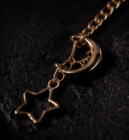 Close up of gold crescent moon and star pendant necklace detail